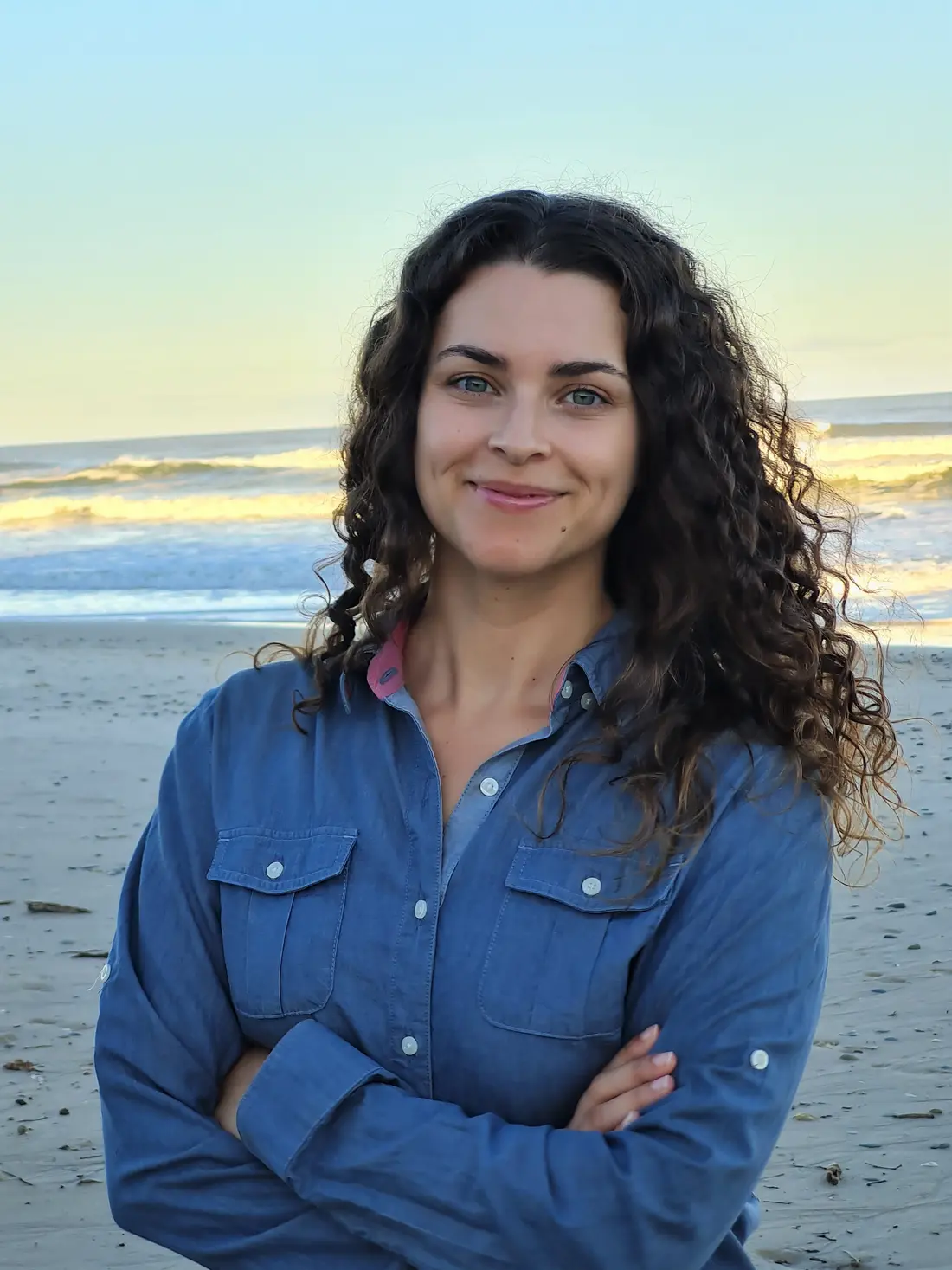 Dr. Gloria Reithmaier standing beside the coast